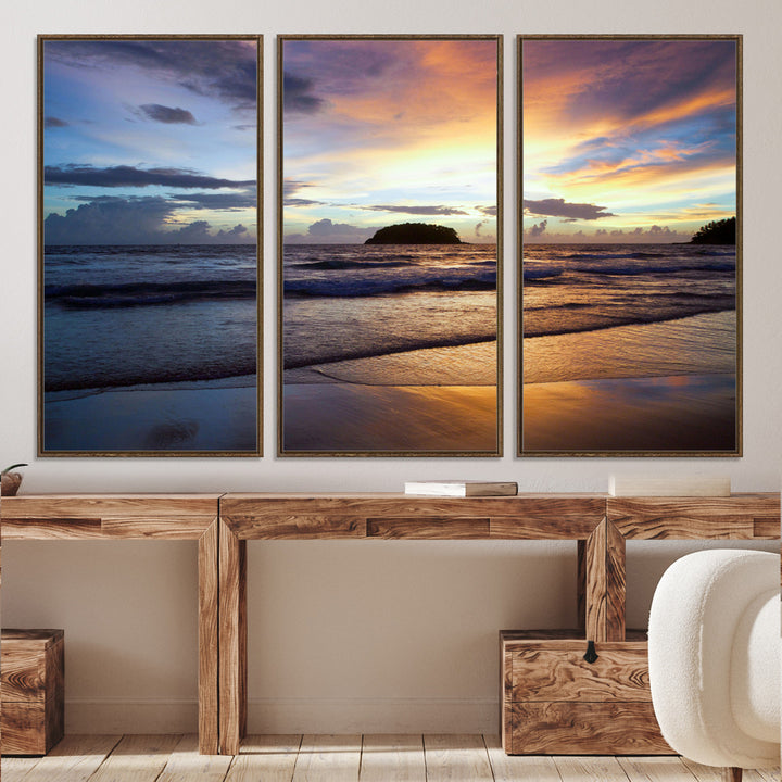 A tropical beach at sunset with waves gently washing ashore, reflecting golden and purple hues in the sky, creating a tranquil coastal scene.