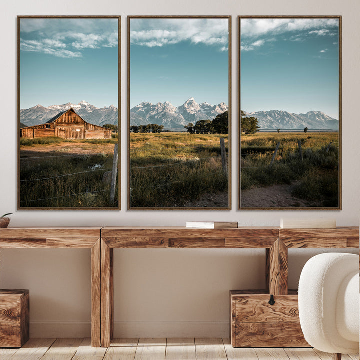 A rustic farmhouse with a wooden barn set against majestic mountain peaks under a soft blue sky, evoking peaceful countryside charm.