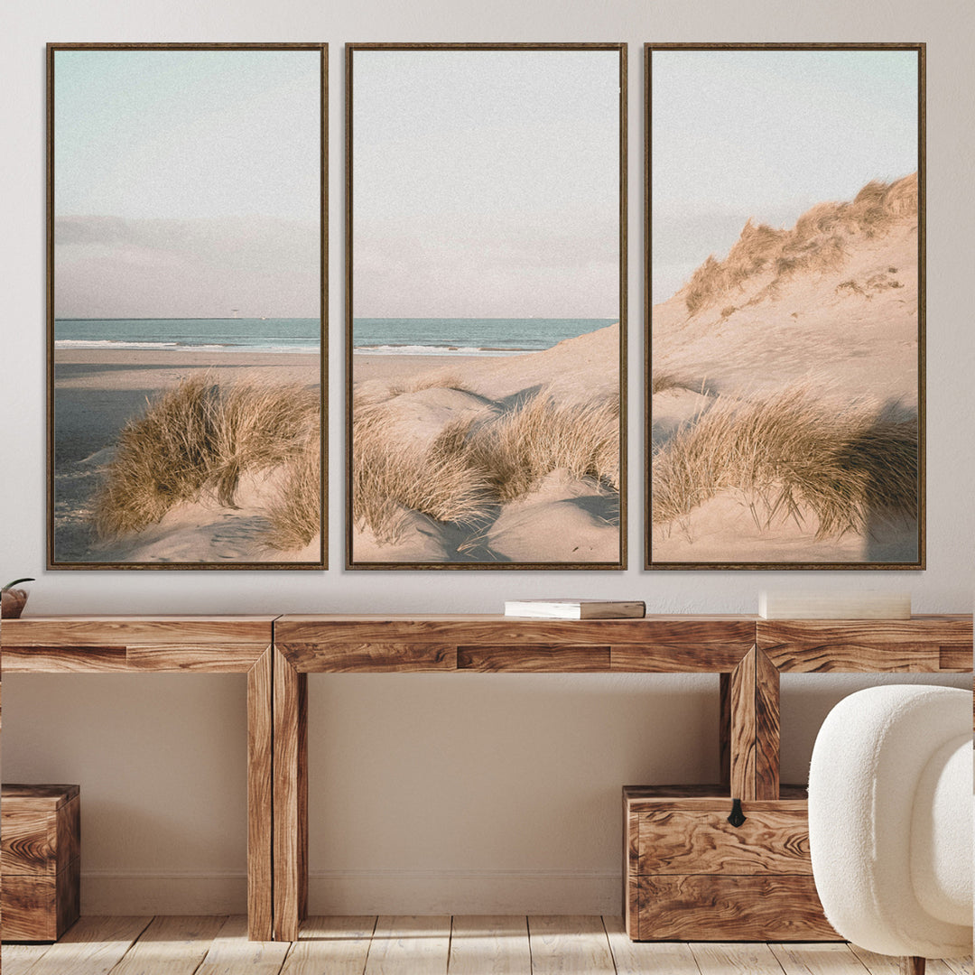 Soft pastel-toned beach scene with sand dunes, windswept grasses, and a calm ocean horizon, creating a serene coastal atmosphere.