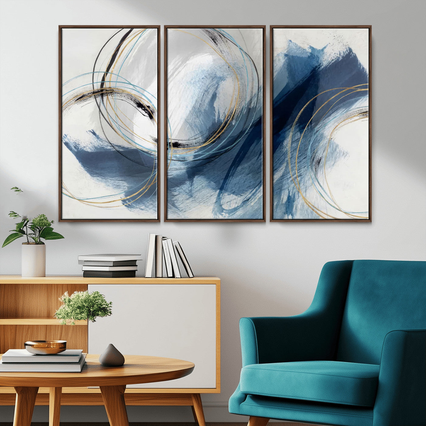 Abstract wall art featuring dynamic brush strokes in shades of blue and gray, overlaid with delicate circular line patterns in gold, black, and light blue on a white background.