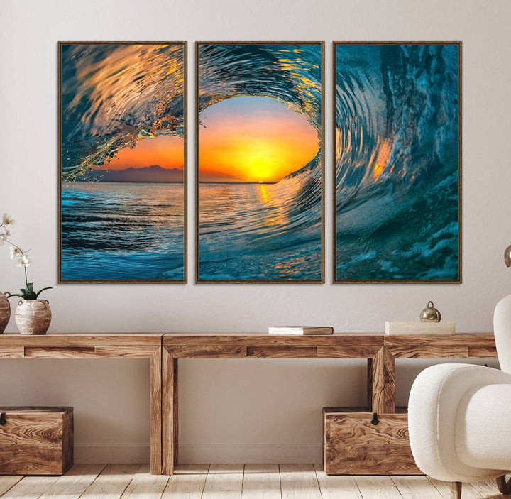 The Ocean Wave Sunset Wall Art canvas print features a vibrant ocean wave at sunset, forming a tunnel with silhouetted mountains.