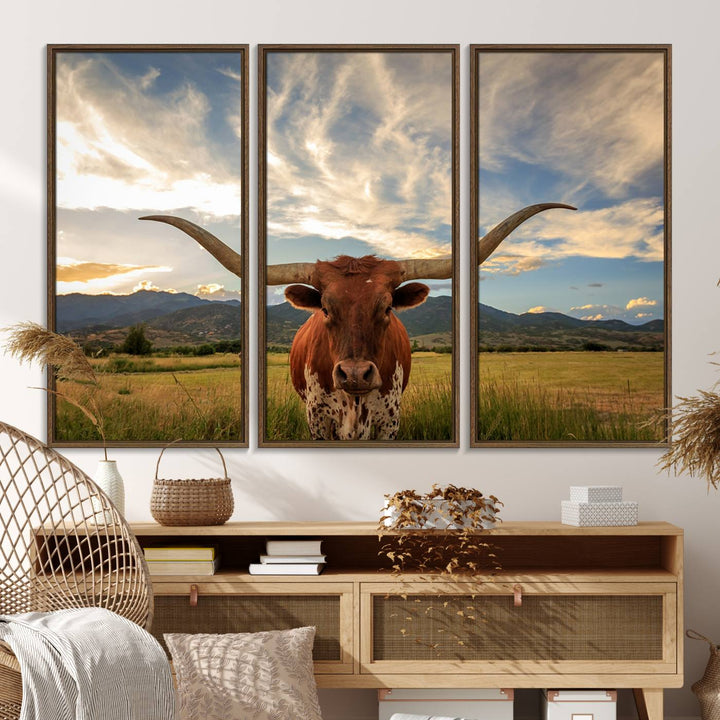 The Texas Longhorn Canvas Wall Art showcases a majestic longhorn steer in a field encircled by mountains under a cloudy sky. Ideal for enthusiasts of rustic western decor, this piece beautifully captures the essence of majestic triptych animal print.