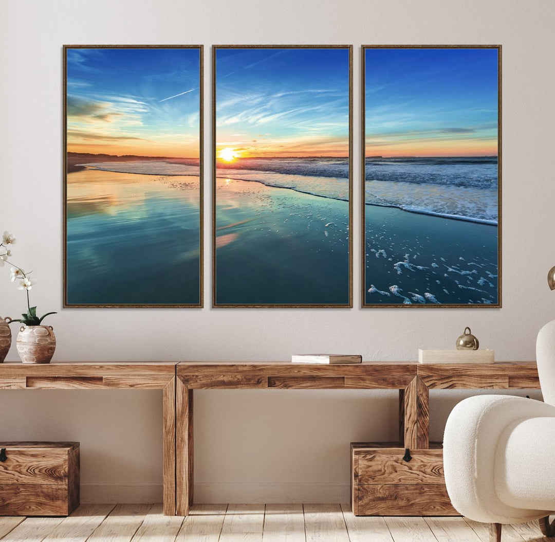 The Blue Sky and Beach Wall Art Canvas Print features a vibrant orange sky reflecting on wet sand.