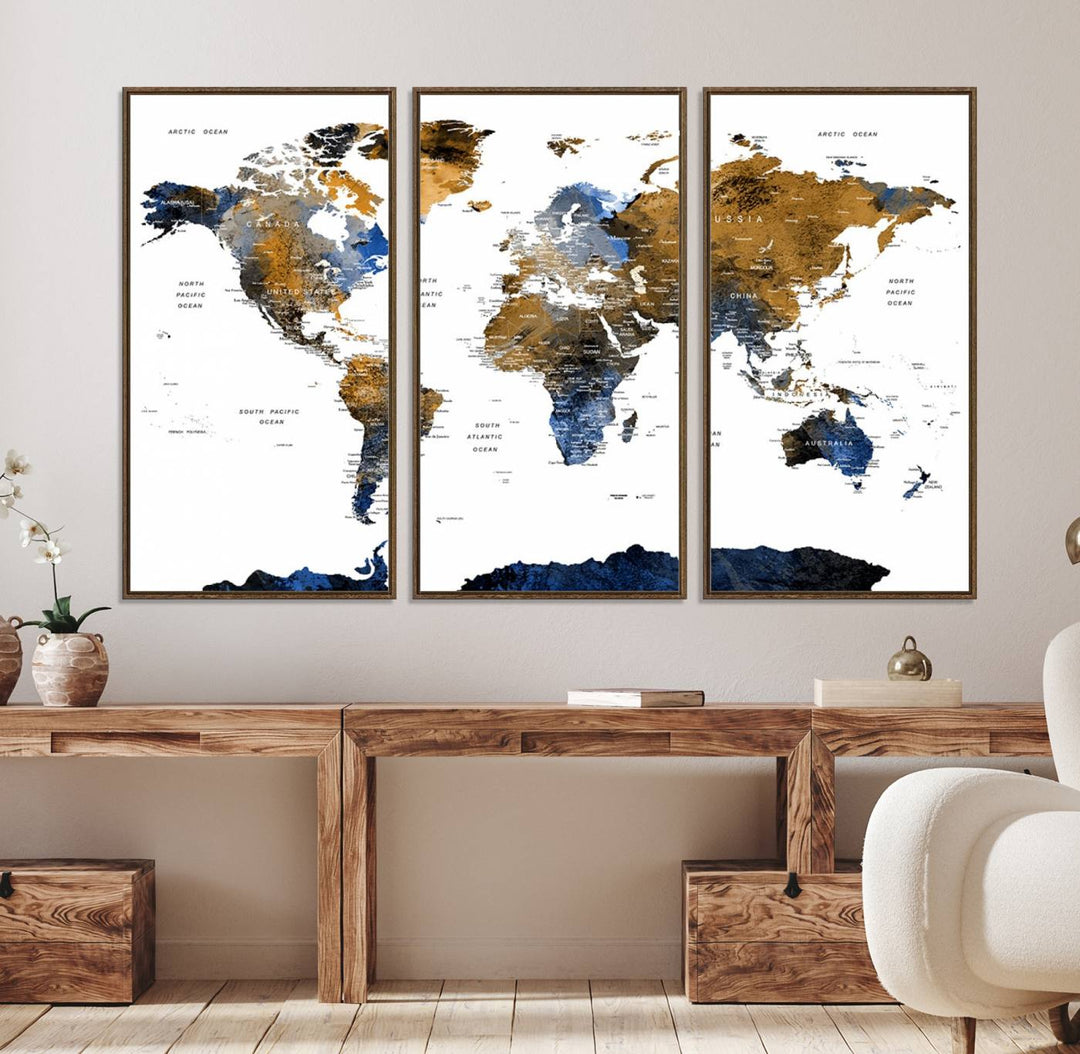 The Triptych Modern World Map Canvas in blue and brown is an ideal global decor piece for enhancing living rooms or offices. It comes ready to hang.