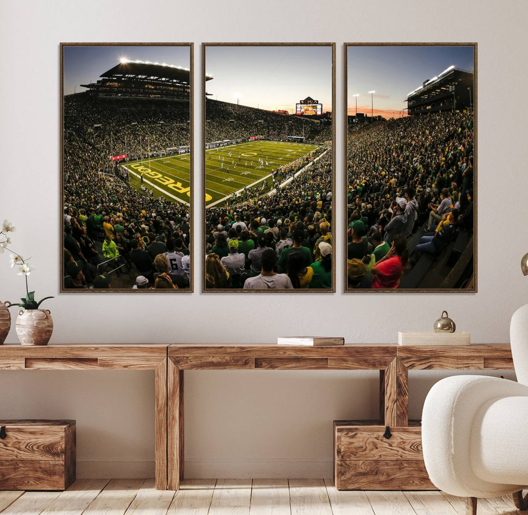 The Oregon Stadium Canvas Wall Art features a depiction of a packed Autzen Stadium with OREGON prominently displayed on the field.