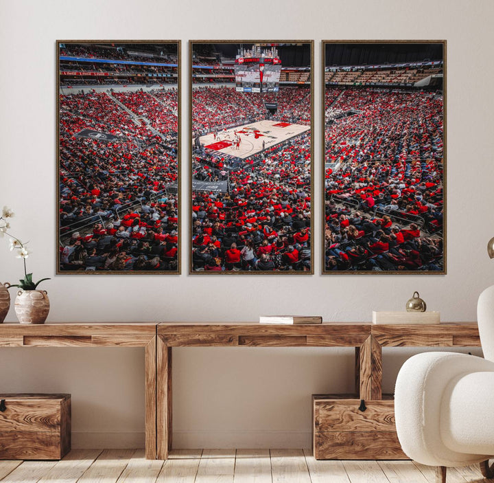 A painting of Louisville Cardinals fans in red at the KFC Yum Center Arena.