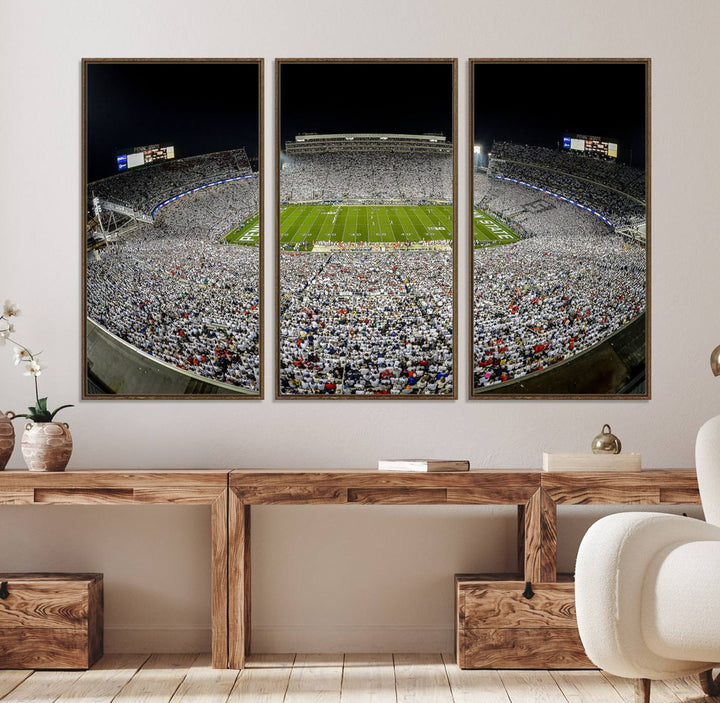 The triple canvas wall art depicts Beaver Stadiums vibrant atmosphere during a night game from the end zone.