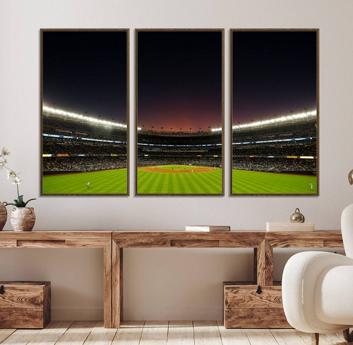 A night game at Yankee Stadium depicted on canvas beneath a sunset sky.