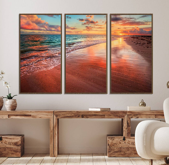 An Ocean Canvas Print depicts a sunset over a beach with reflections.