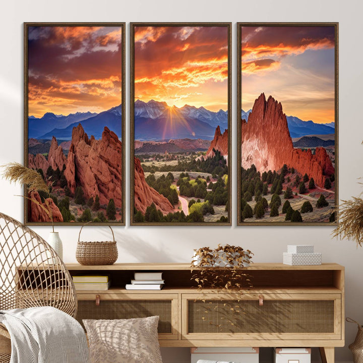 A vibrant sunset over the Rocky Mountains with red rocks.