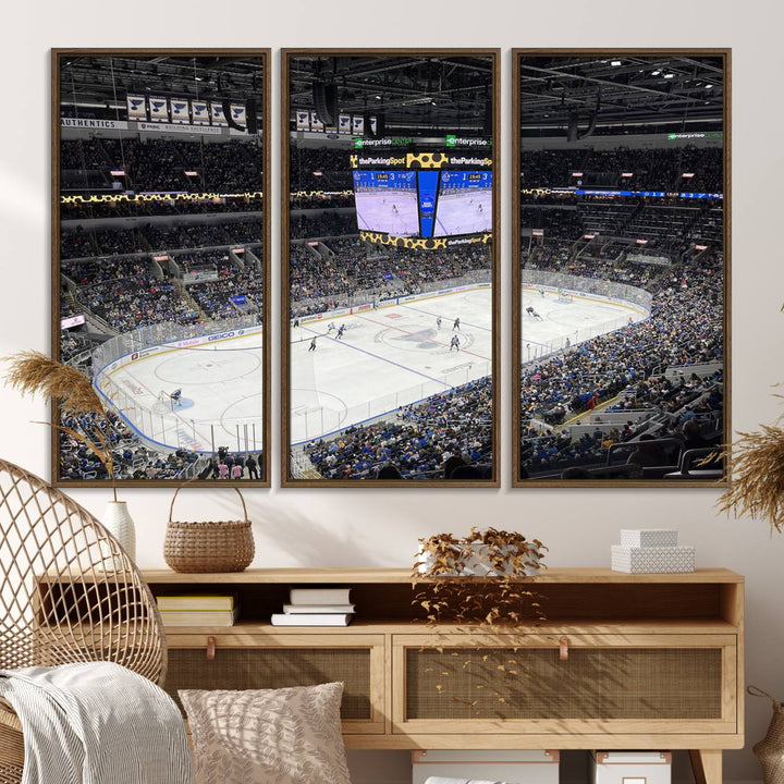 A large Enterprise Center canvas of a crowded hockey arena hangs prominently.