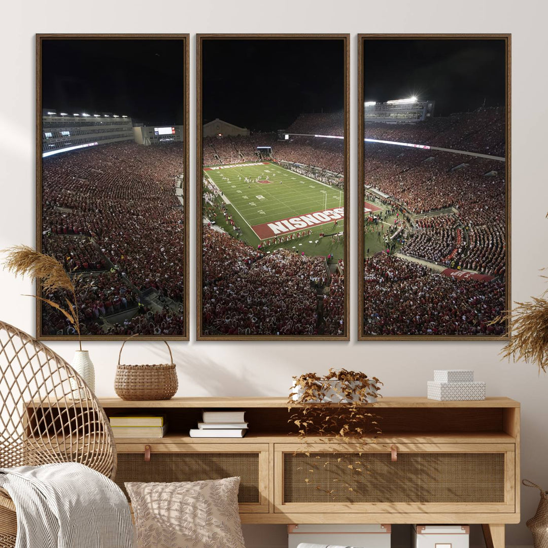 A painting of a stadium packed for a Wisconsin Badgers game, with WISCONSIN clearly visible in the end zone at Camp Randall Stadium.