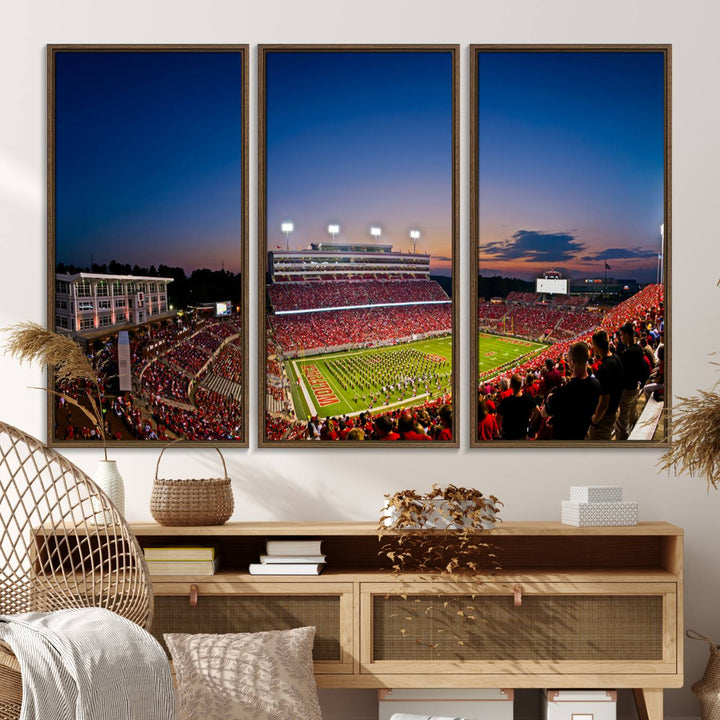 The Wolfpack Football Team Print captures a band and crowd at dusk in a premium canvas art style at Raleigh Carter-Finley Stadium.