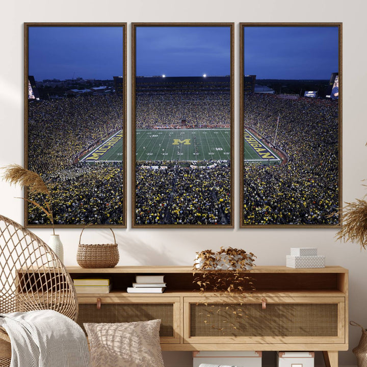 Wall art featuring an aerial shot of Michigan Stadium at dusk, showcasing the University of Michigan Wolverines M logo.