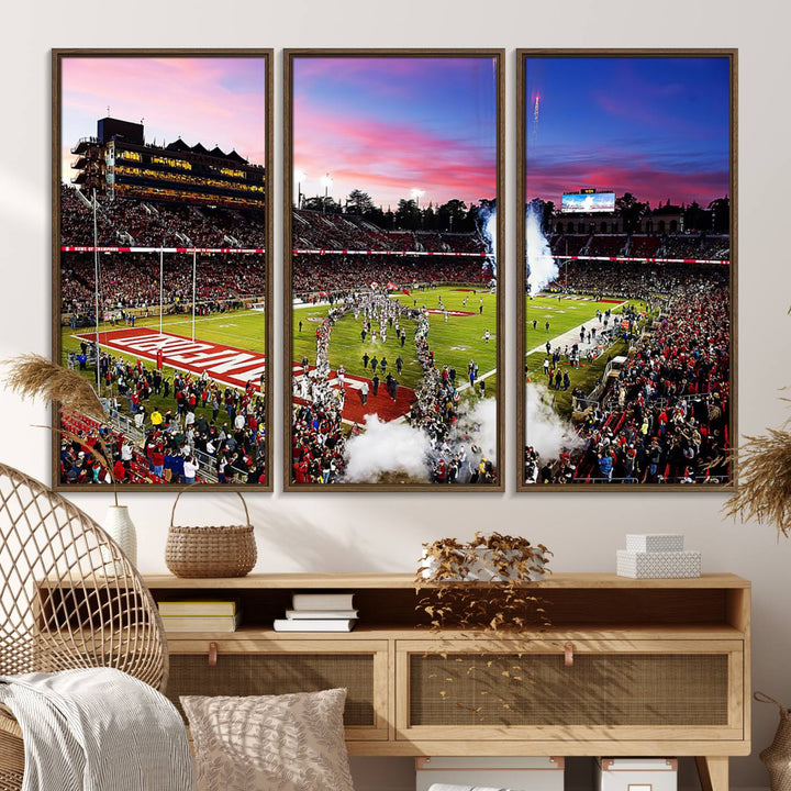 The wall art features a canvas print of the Stanford Cardinal football team, capturing players, fireworks, and smoke against the backdrop of a sunset at Stanford Stadium.