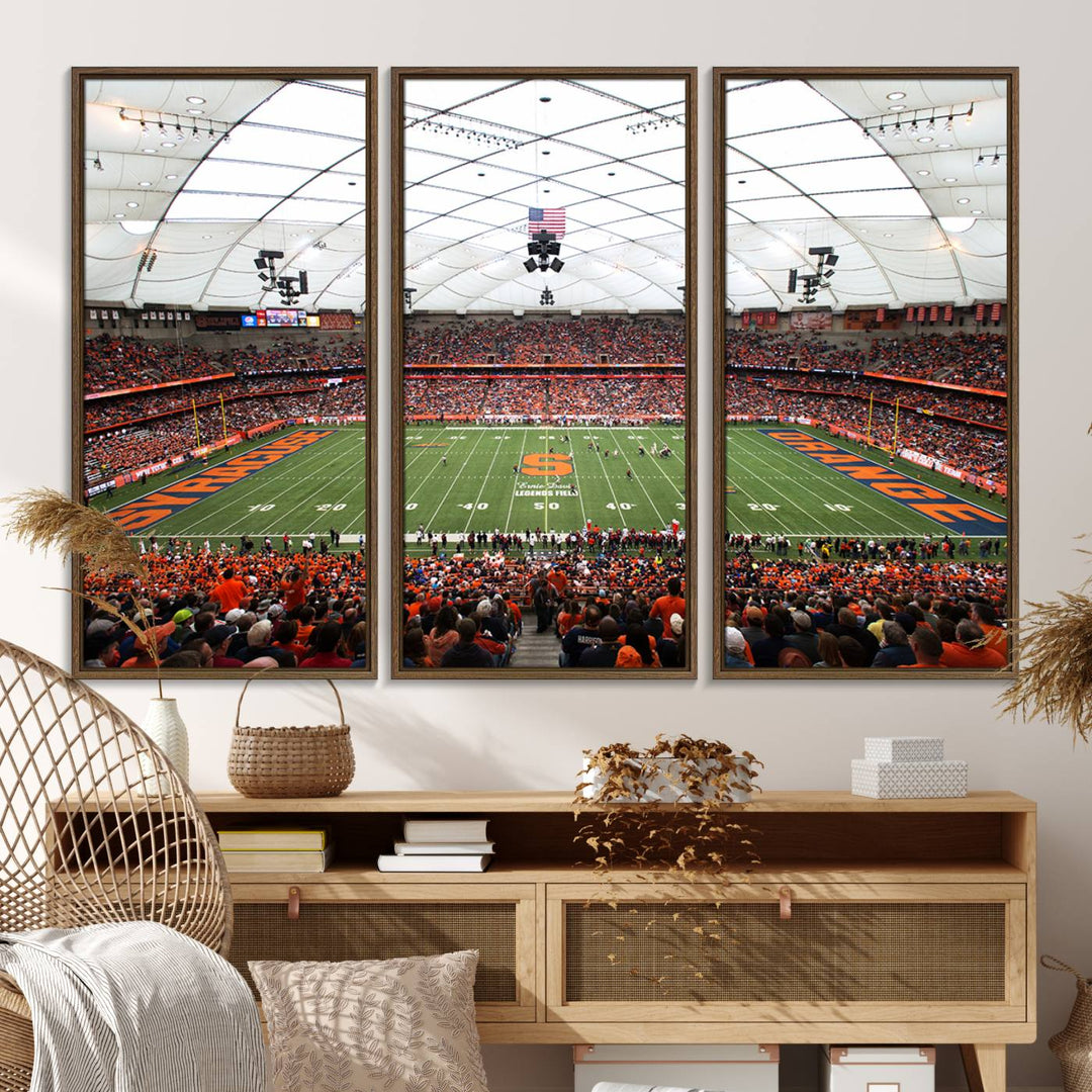 Fans fill the Syracuse JMA Wireless Dome, highlighted in orange and blue under a vaulted roof on this premium canvas print of the scene.