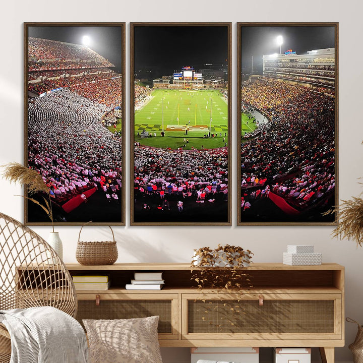 The Maryland Terrapins Football Wall Art Canvas showcases a packed SECU Stadium at night with a bright field and cheering fans.