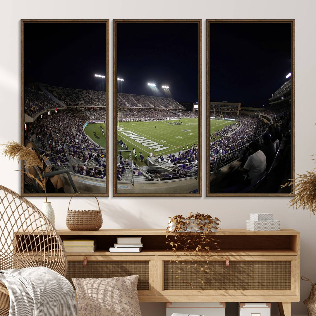 The wall art print features a night view of Amon G. Carter Stadium filled with TCU fans, showcased in the Horned Frogs Football Canvas Wall Art.