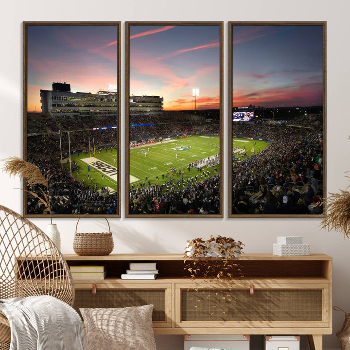 This wall art canvas print captures UCONN Huskies fans energizing a sunset scene at East Hartfords Pratt & Whitney Stadium.