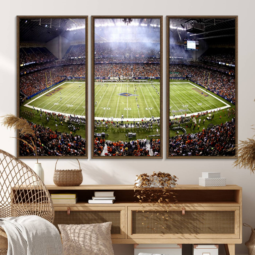 The modern living room features an Alamodome wall art canvas print, depicting a stadium filled with spectators for a UTSA Roadrunners game.