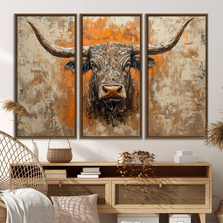 Abstract Cow Longhorn Bull Wall Art presents a detailed face centered on a textured orange and beige background.