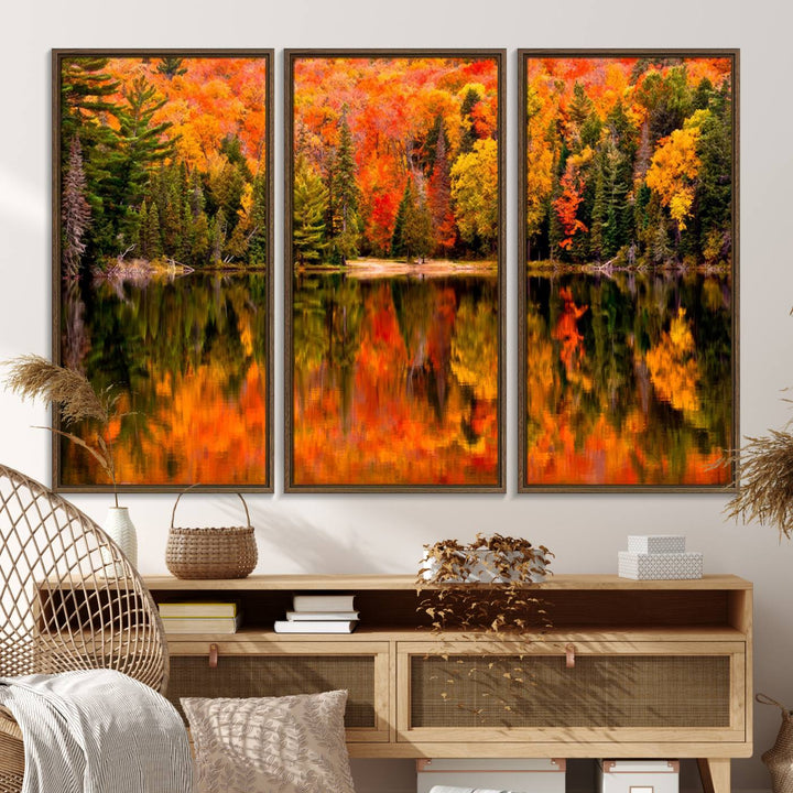 Autumn Forest Reflection Wall Art: a vibrant triptych canvas featuring fall foliage with red, orange, and yellow leaves over a calm lake.