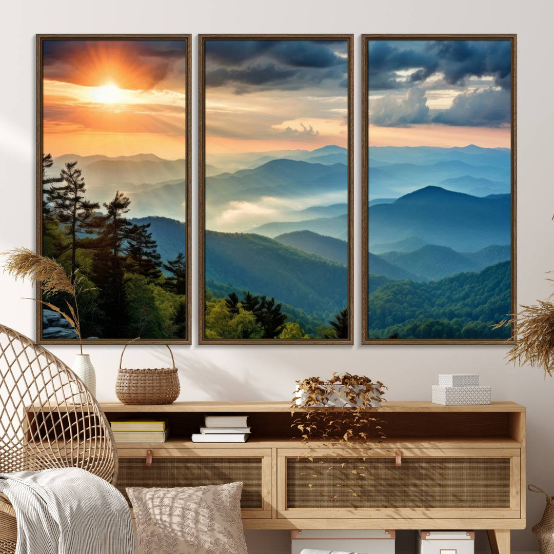 The wall art, titled Sunrise Over Mountain Range, is a canvas print that beautifully depicts layers of hills, scattered trees, and a partly cloudy sky.