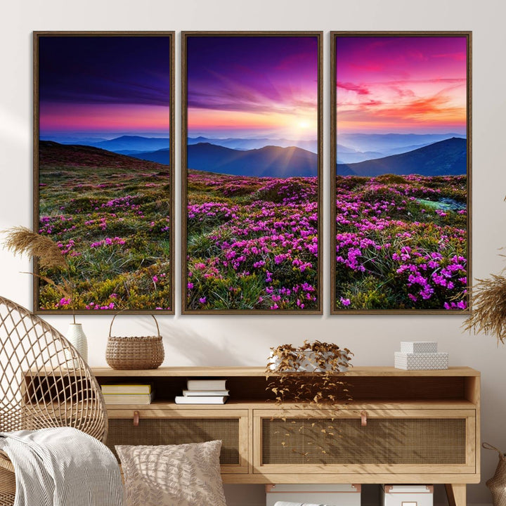 A 3-panel landscape photography canvas of a sunset over mountain meadows with purple wildflowers decorates the wall.