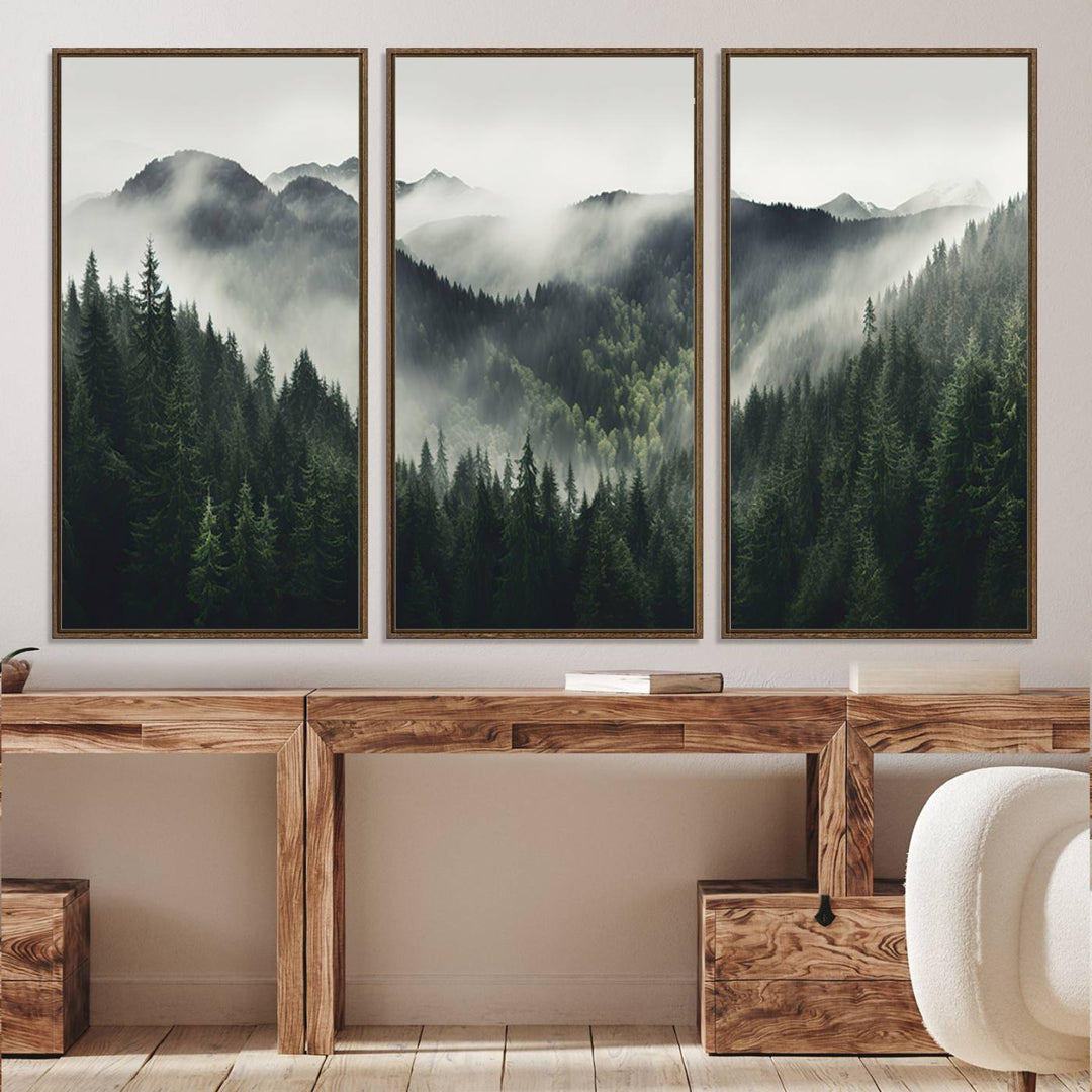 The Misty Forest Canvas Print Wall Art captures a serene misty forest scene with fog and mountains.