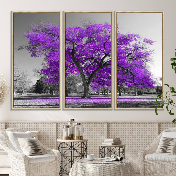 The Big Purple Tree Wall Art Canvas Print showcases a vibrant purple tree set against a black-and-white landscape.