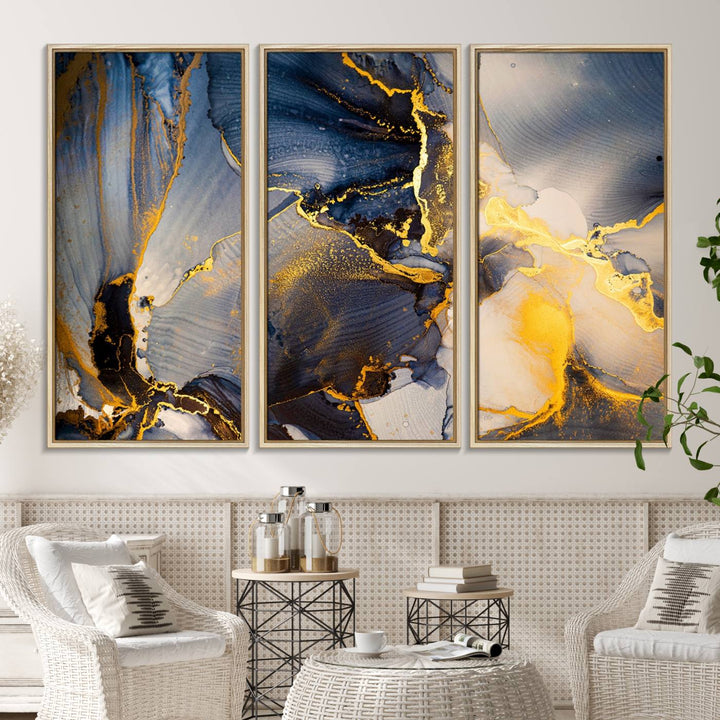 A modern luxury kitchen features a large gold and blue abstract canvas wall art print.