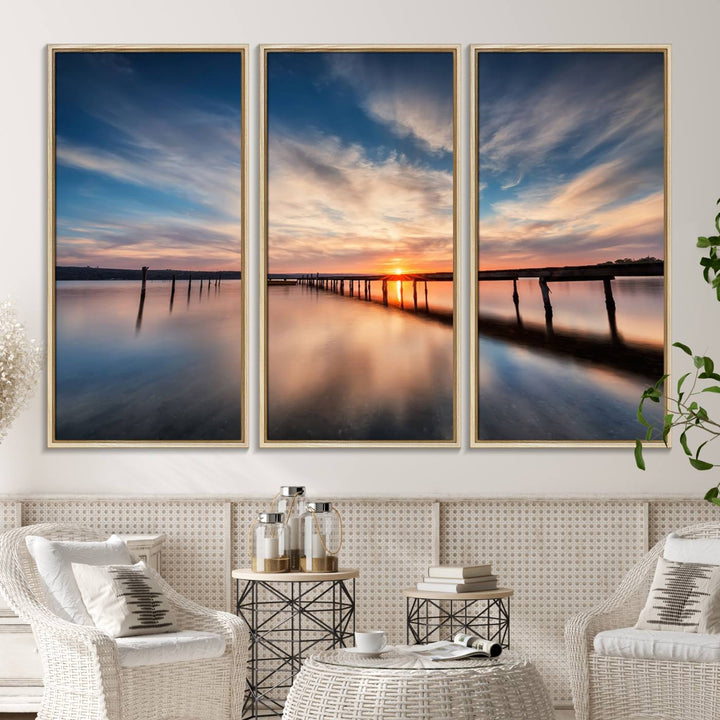 The Sunset Pier Canvas features a serene coastal landscape with vibrant hues under cloudy skies, ideal for modern decor.