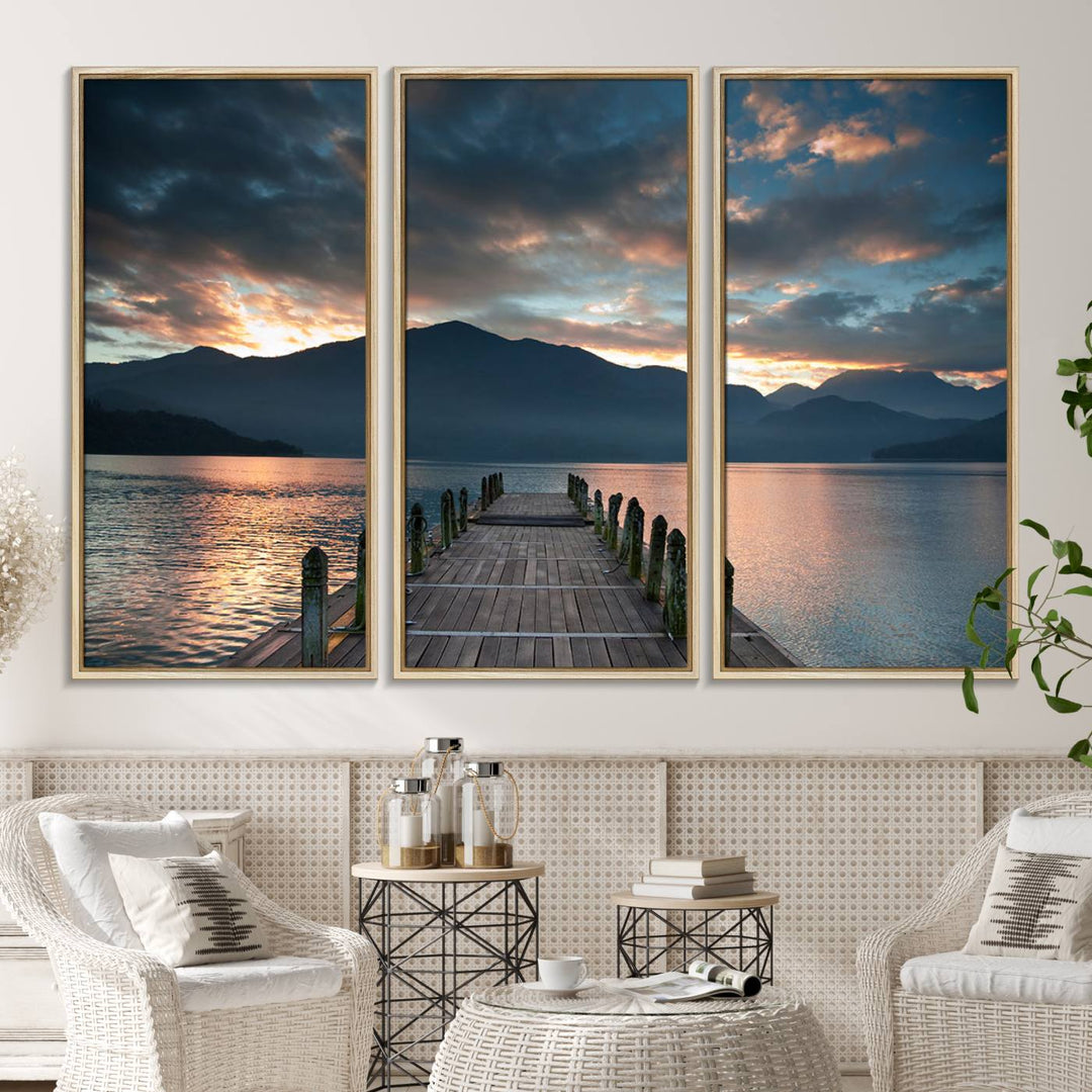 The Mountain Lake Wood Pier Canvas Wall Art depicts a serene lake and mountains, enhancing the beauty of any space.