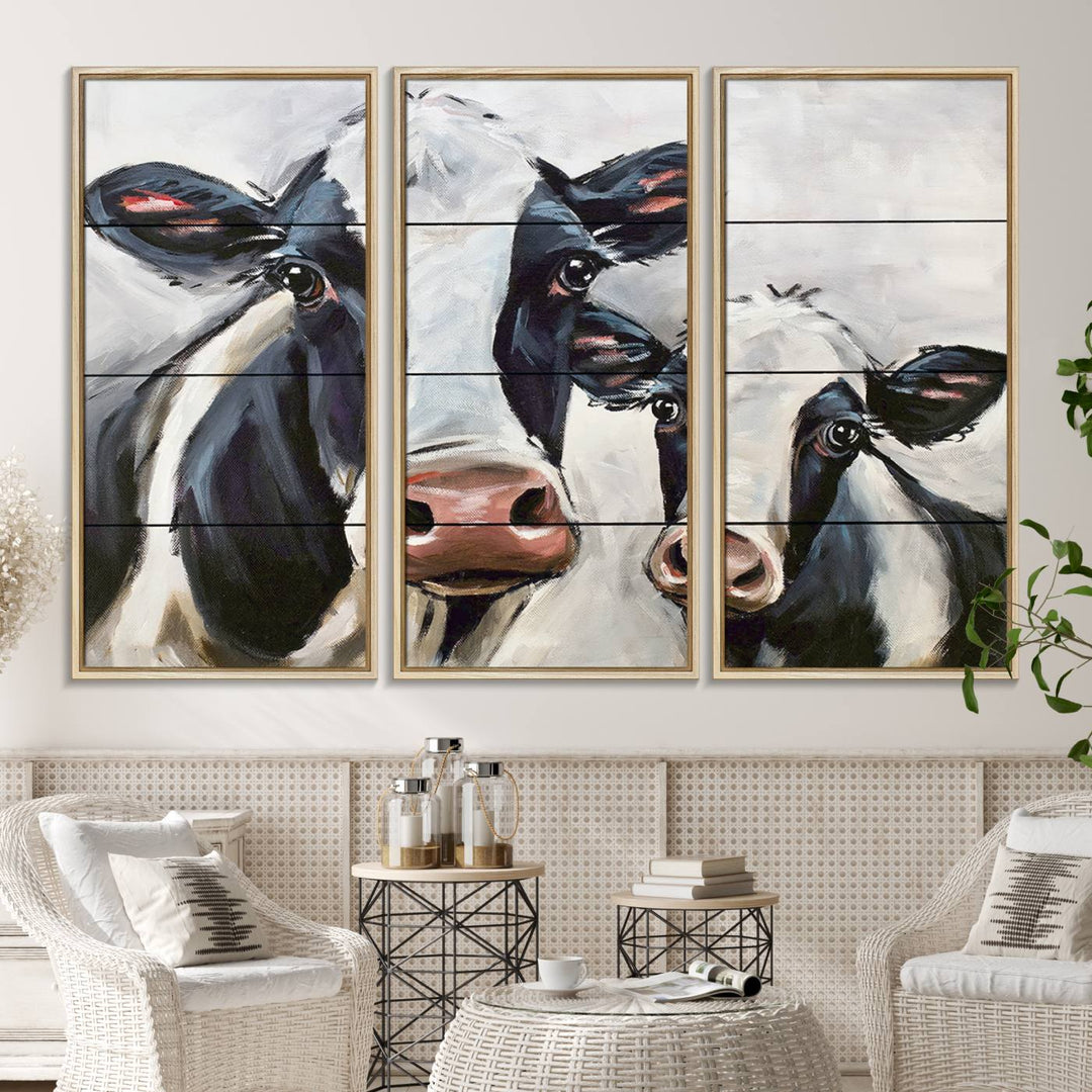 The Vintage Baby and Mom Cattle Canvas, featuring cows with black and white patches, is a prominent piece of wall art.