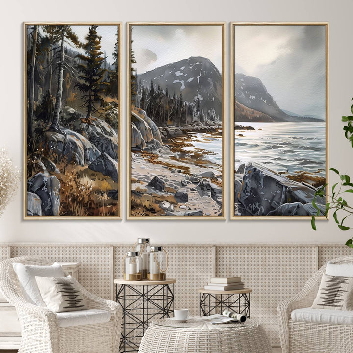 Framed wall art depicting Acadia National Parks rocky coast, trees, mountains, and sunlight over the sea; ready to hang.