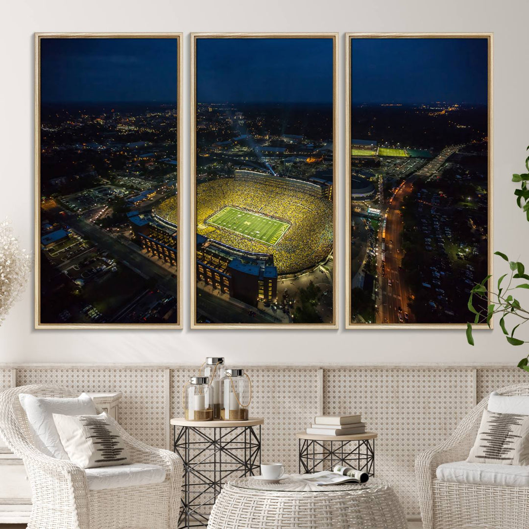 Aerial view of Michigan Stadium at night, surrounded by city lights, depicted on a Michigan Wolverines wall art canvas print.