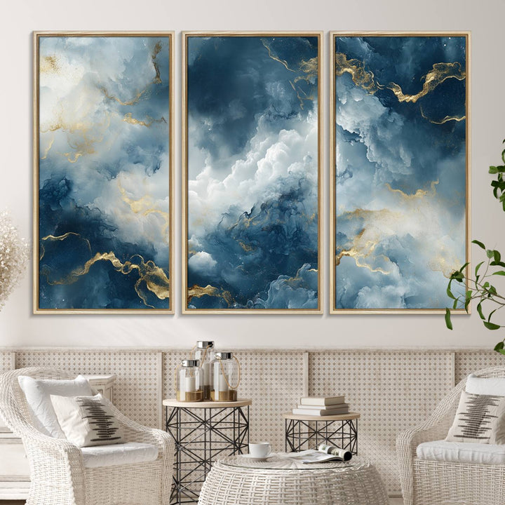 The "Large Abstract Print - Luxe Blue and Gold Abstract Canvas Wall Art" features a bold cloudscape design with swirling white patterns, ideal for modern home decor in living rooms or offices.