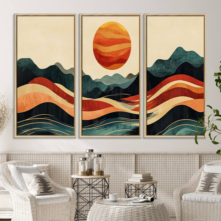 The Mountain Triptych wall art, featuring a design of the sun, mountains, and waves, is displayed prominently on the wall.