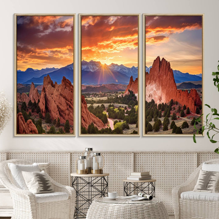 A vibrant sunset over the Rocky Mountains with red rocks.