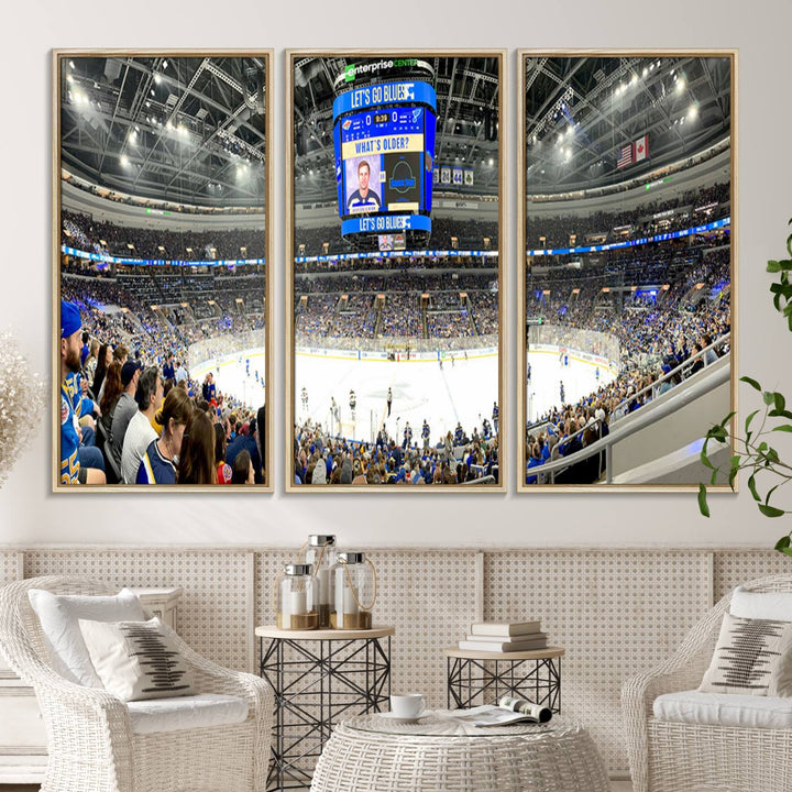 Wall art prints depicting the bustling scenes of the St. Louis Blues being cheered on by a full house at the Enterprise Center, beneath a large scoreboard.