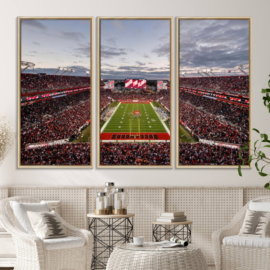 The wall art captures a stunning scene of Raymond James Stadium bathed in the warm hues of sunset. The sky, filled with clouds, provides a dramatic contrast to the vibrant lighting on the field, encapsulating the dynamic energy of a football game.