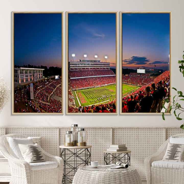 A vibrant and dynamic painting captures the essence of an electrifying night game at Carter-Finley Stadium, highlighting the illuminated atmosphere as the NC State Wolfpack competes under bright stadium lights.