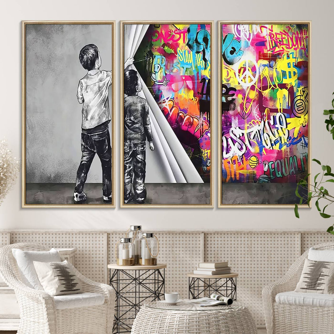 The Banksy Print - Street Art Canvas features a vibrant and bold image of two children lifting a curtain to reveal colorful graffiti. It's ready to hang, adding an urban modern decor vibe.