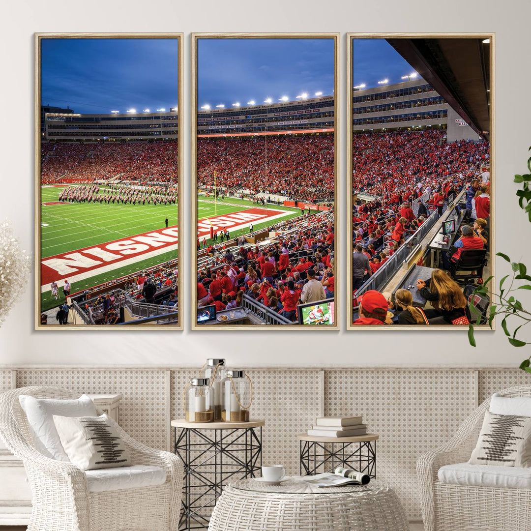 A vibrant wall art captures the essence of Madison Camp Randall Stadium, depicting a sea of fans in red and white during a Wisconsin Badgers football game under bright lights.