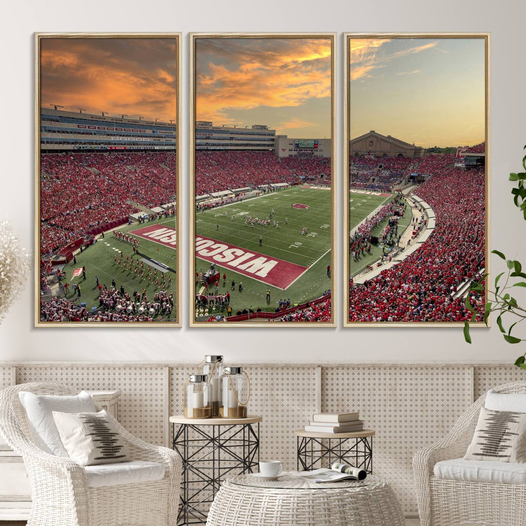 The wall features a Wisconsin Badgers wall art canvas print, capturing the vibrant atmosphere of a full Camp Randall Stadium at sunset.