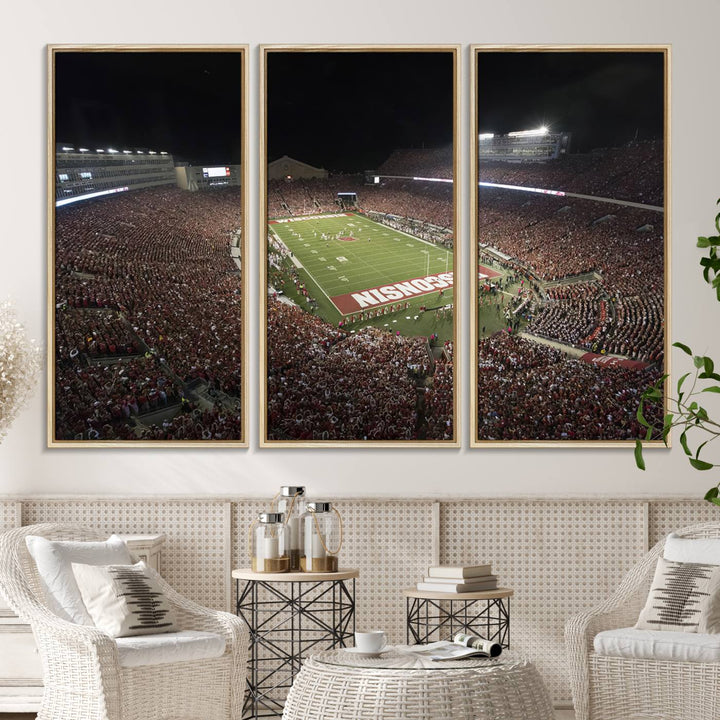 A painting of a stadium packed for a Wisconsin Badgers game, with WISCONSIN clearly visible in the end zone at Camp Randall Stadium.