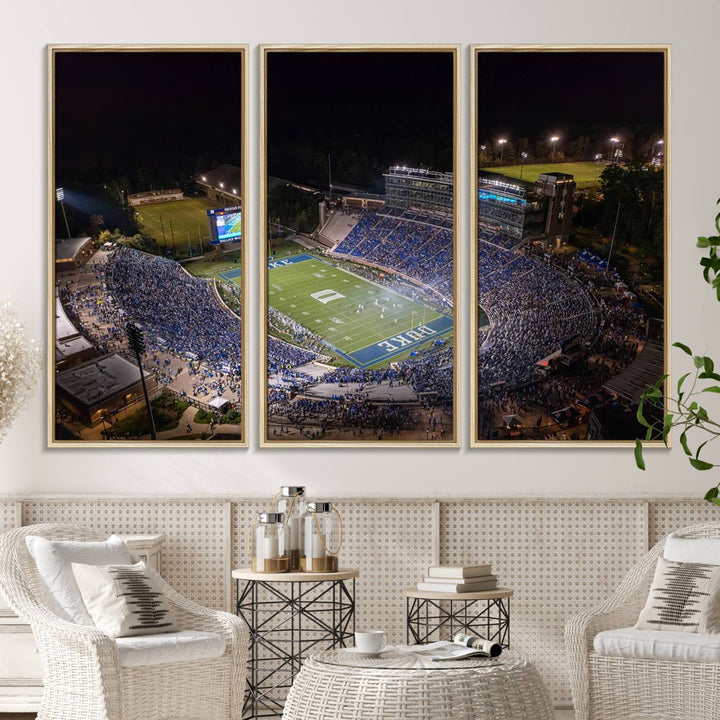 Night aerial view of packed Duke Blue Devils Wallace Wade Stadium, surrounded by trees and illuminated by lights; perfect for high-resolution prints.