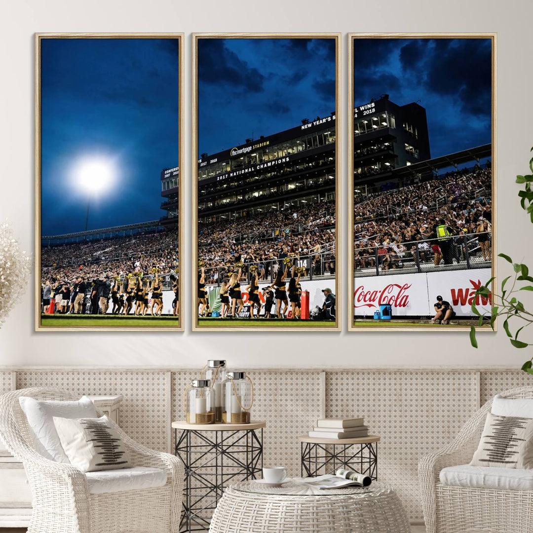 A gallery-quality canvas print depicting a stadium packed with fans under a night sky, highlighting the UCF Knights Football Team.