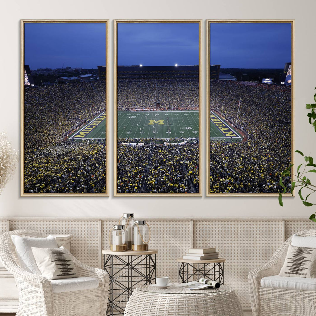 Wall art featuring an aerial shot of Michigan Stadium at dusk, showcasing the University of Michigan Wolverines M logo.