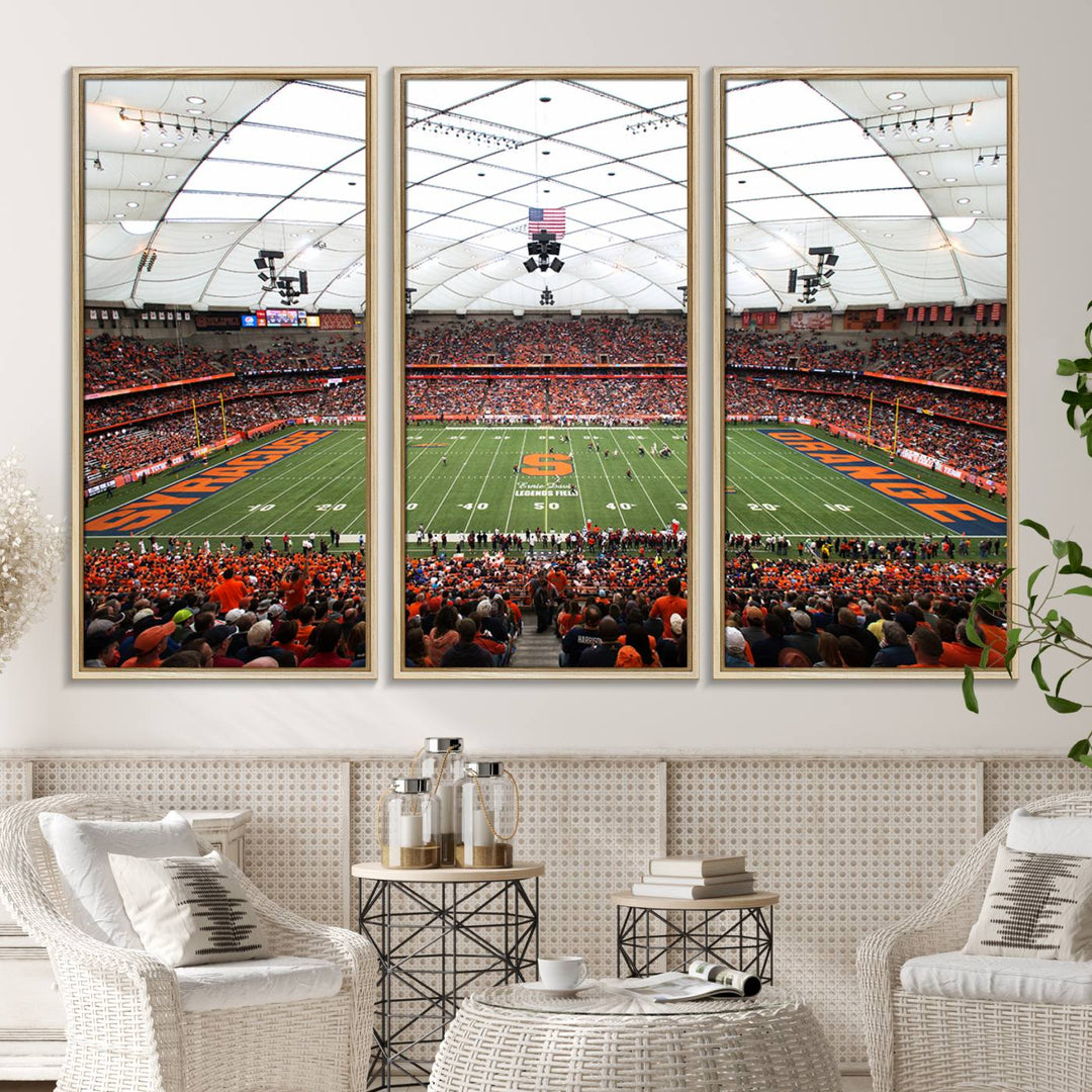 Fans fill the Syracuse JMA Wireless Dome, highlighted in orange and blue under a vaulted roof on this premium canvas print of the scene.